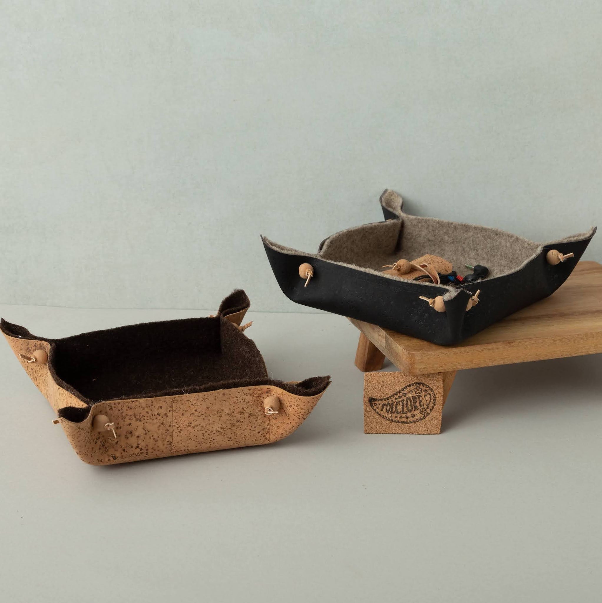 natural and black cork fabric with grey and dark brown burel valet trays