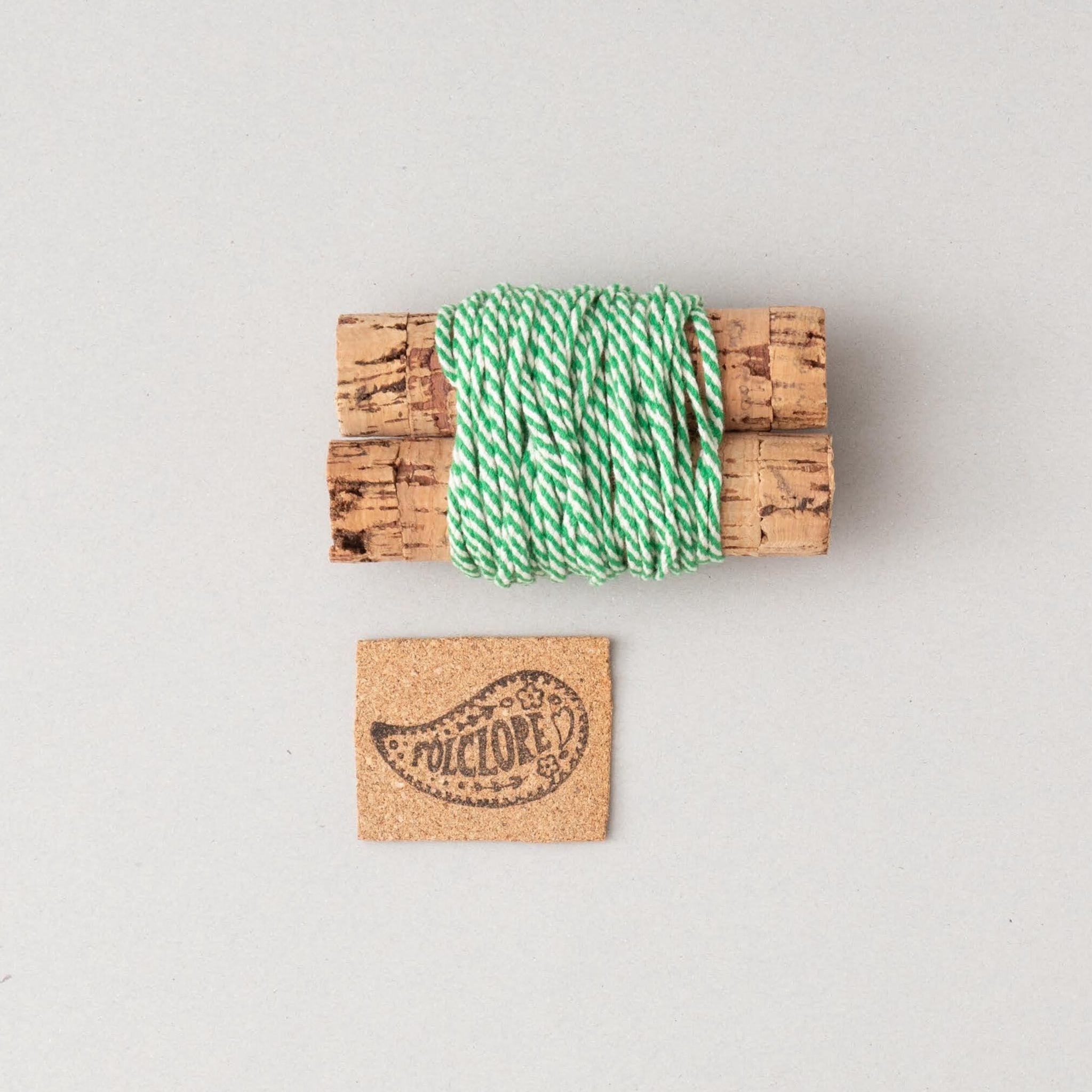 white and green cotton cord on cork cables