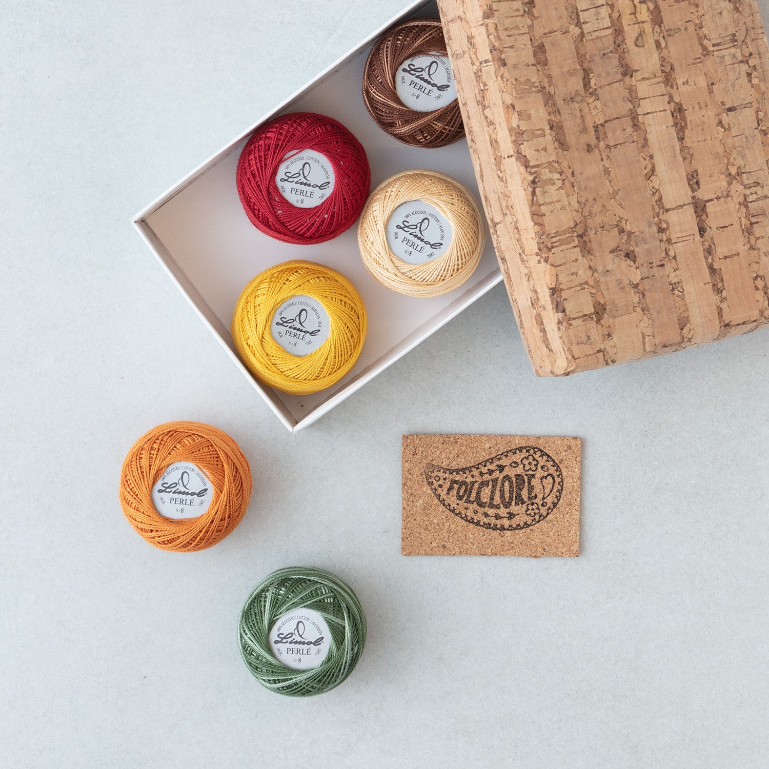 Perle cotton balls in a cork box – Fall colors